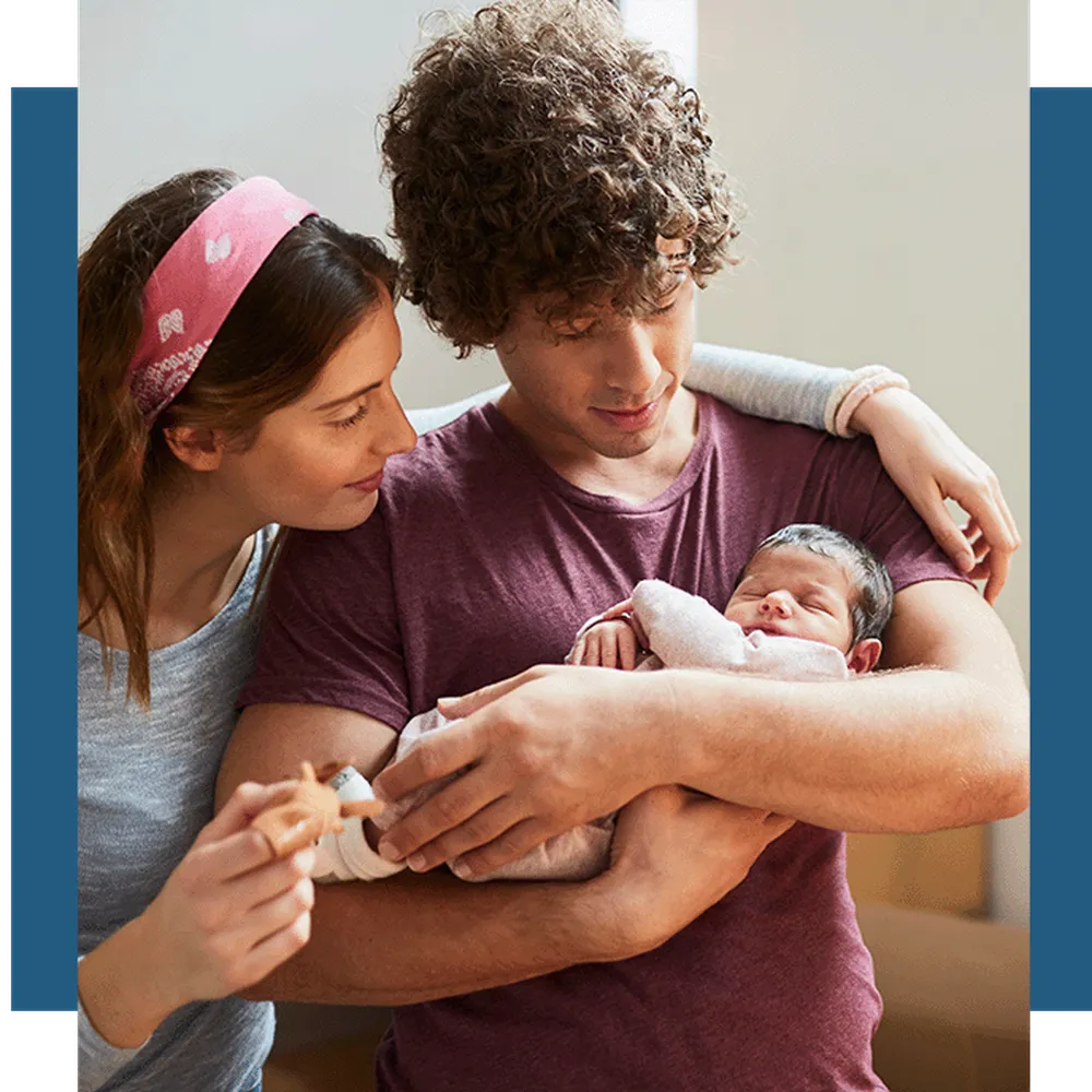 ICSI success rates - Couple holding their baby