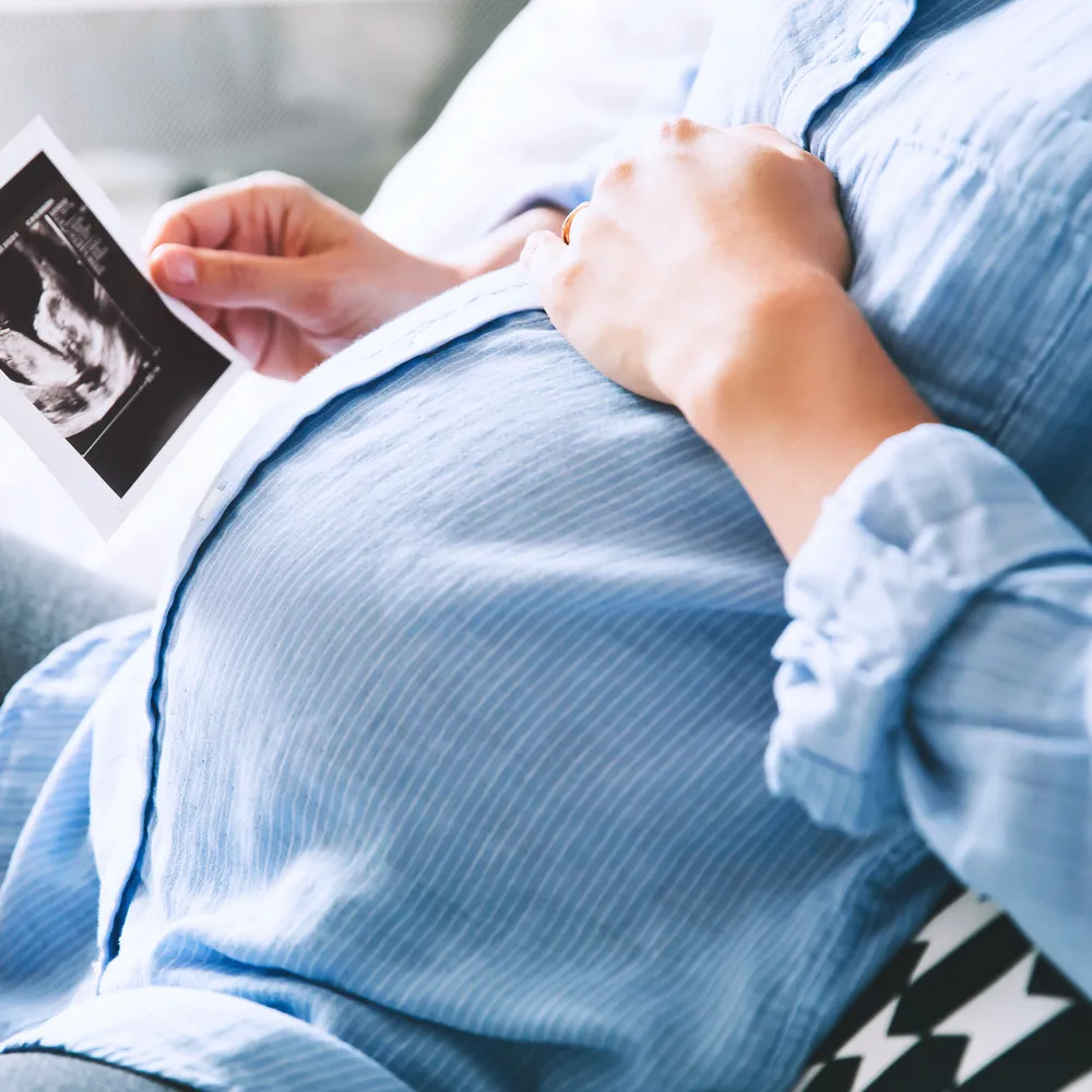 Pregnant woman looking at ultrasound