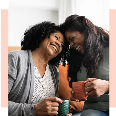 Two women laughing together