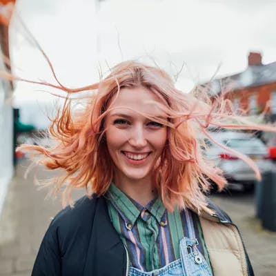 Women enjoying the wind in her hair