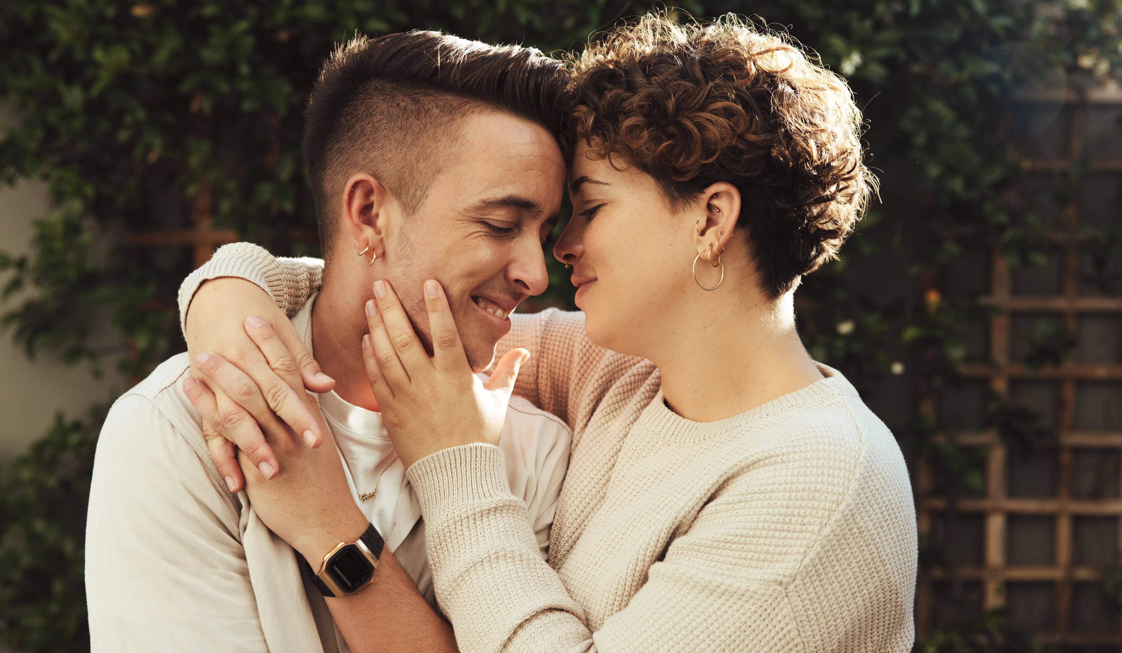 A transgender couple hugging